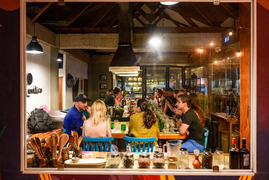 Cartagena: Boutique Rum and Chocolate Tasting at Lunático - Entering Lunático, with Castillo San Felipe in your line of sight