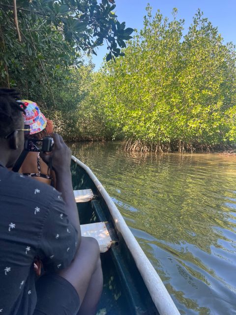 Cartagena: Mangrove Eco Tour & Fishing with Transportation - On the boat, trying traditional fishing with nets and traps
