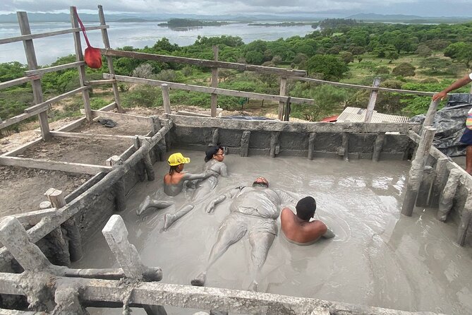 Cartagena Mud Volcano Tour — VIP Exclusive Crowd-Free Access! - Entering Volcan de Lodo El Totumo, Floating in Mineral Mud