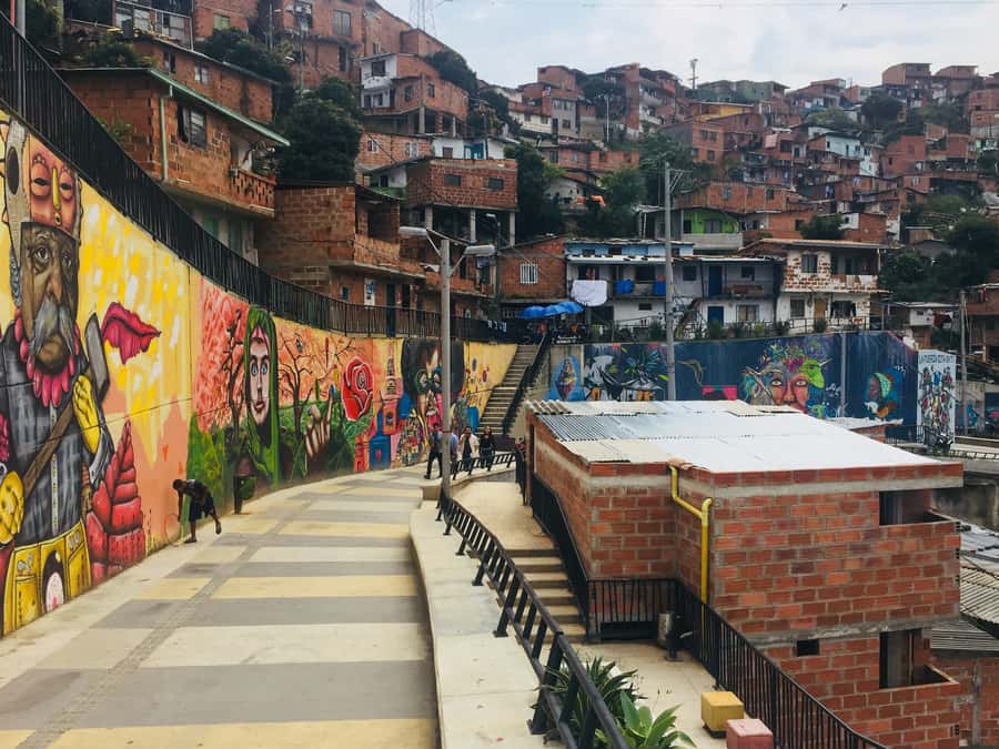 Comuna 13 and Downtown Medellín City Tour - Food Tasting in Downtown: How a Snack Becomes a Lesson