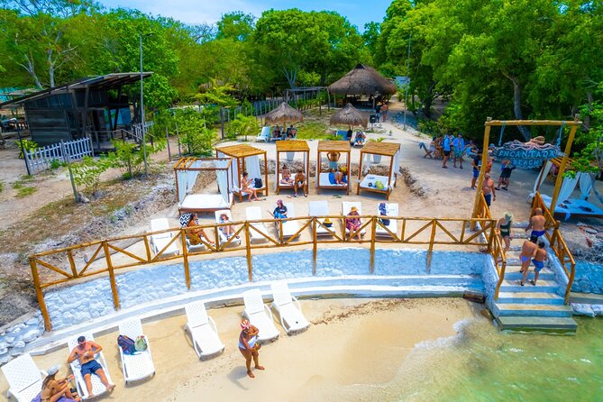 Discover Isla del Rosario Live The Enchanted Beach Experience - Encanta Beach on Isla Grande: welcome drinks, beach-club access, and your lounge setup