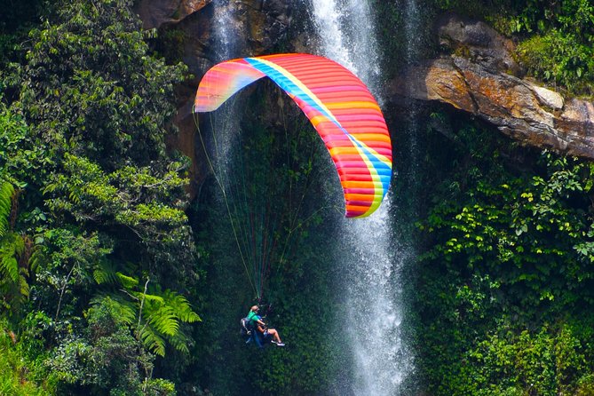 Fun RAFTING + Awesome PARAGLIDING over giant waterfalls from MEDELLIN - A Full Day of Water Power and Air Time from Medellín