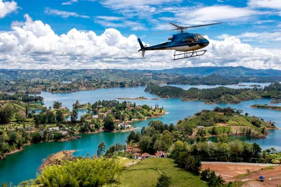 Medellín: Guatapé Private Tour with Helicopter & Boat Ride - Climbing the Rock of Guatapé: viewpoint time and ticket budgeting