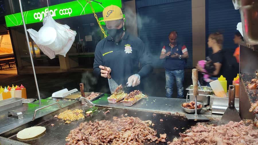 Medellin: Street Food and Poblado Rooftop Tour with a Local - Five Colombian street-food snacks, and the arepa lesson that lands