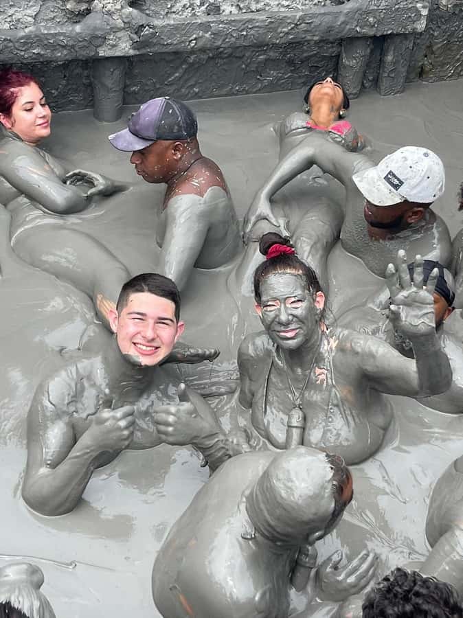 Mud Volcano Tour in Cartagena with Lunch - The rinse-off lake behind the volcano, with local help