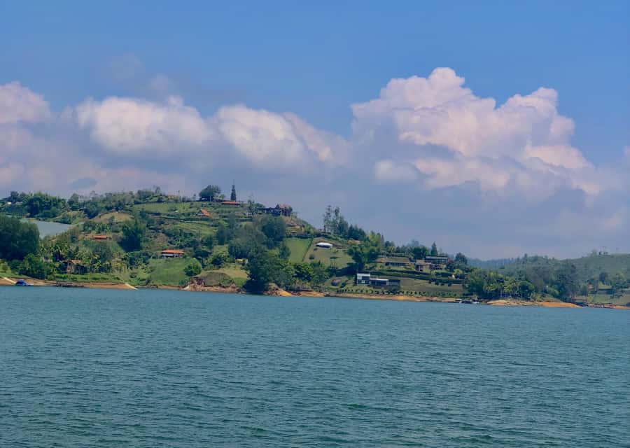Tour Guatapé - Piedra del Peñol with departure from Medellín - Guatapé town highlights: boardwalk, Memories Street, and umbrella photos