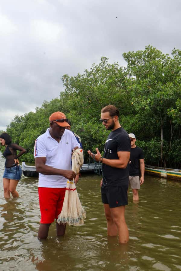 Typical lunch on beach, mangrove tour & fishing with natives - Fisherman Island, drum culture, and trying artisanal net and crab methods